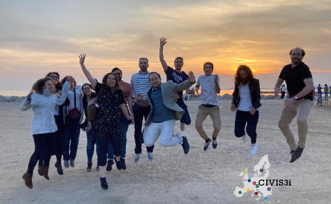 First cohort of postdoctoral fellows jumping against the beautiful seaside sunset in Marseille